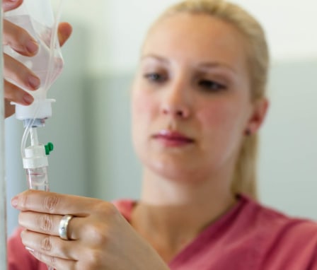 IV Nurse prepares an infusion