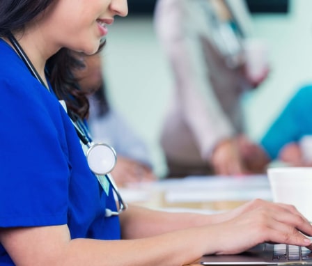 Nursing student studying on laptop