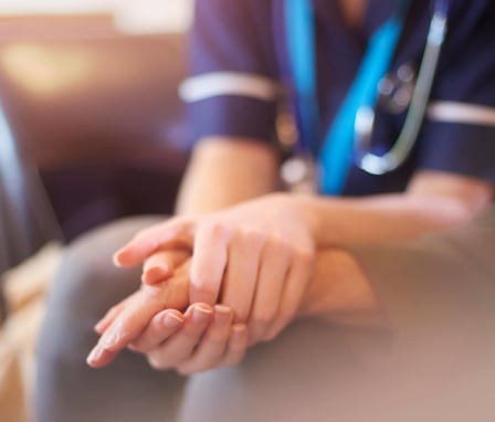 Nurse consoling patient