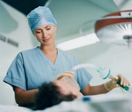 Nurse Anesthetist Holding a Mask on a Patient's Face