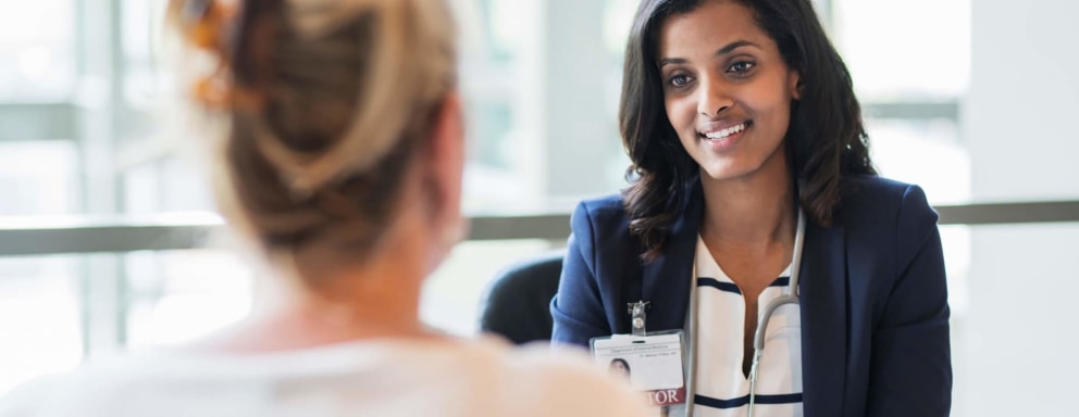 Managerial nurse chatting with patient