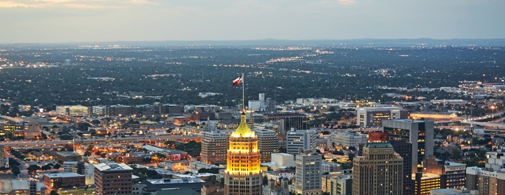 Aerial view of San Antonio illuminated at dusk