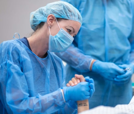 Midwife comforting patient