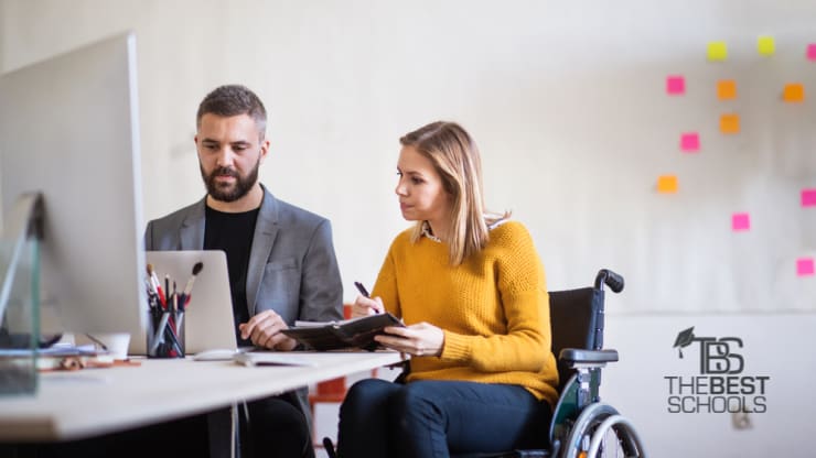 Most Affordable Online Bachelor’s in Marketing hero image, two employees at a desk looking at computer monitor