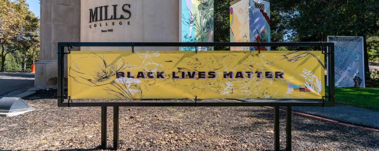 Image of Mills College campus with banner reading 'Black Lives Matter'