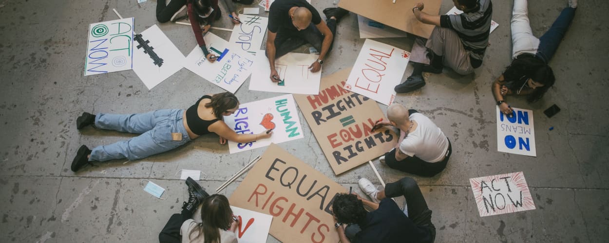 Image of student protesters creating signs