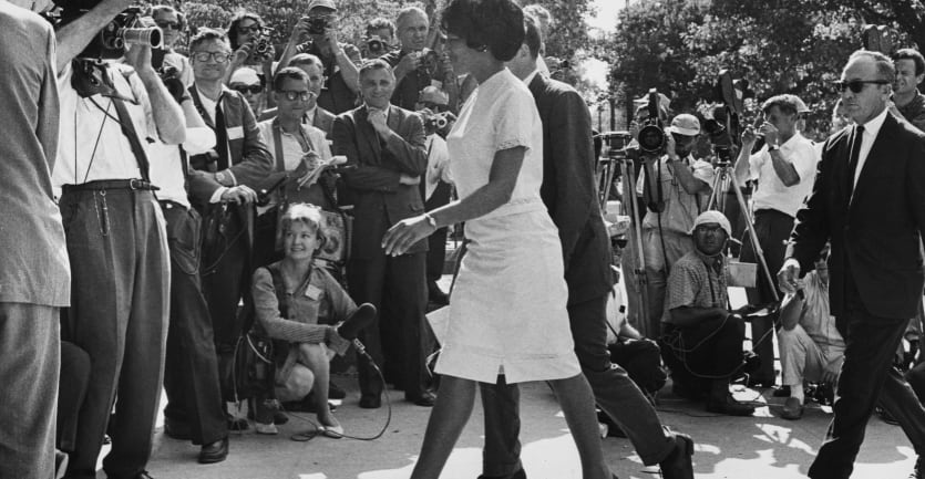 Vivian Malone and James Hood walk through the crowds as they become the first Black students to enrol at the University of Alabama in Tuscaloosa, Alabama, on June 11, 1963.
