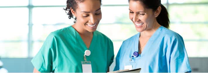 two nurses smiling