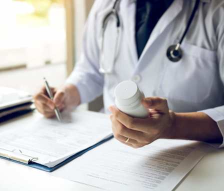 Doctor working on a prescription