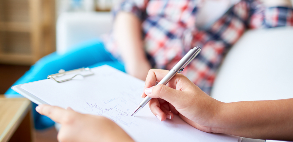 Taking notes on a clipboard