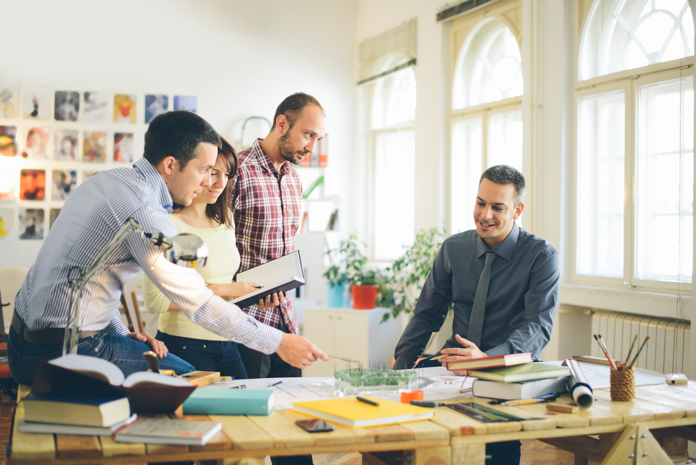 Team meeting at a desk