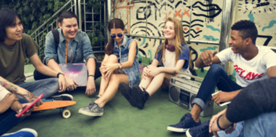 A group of young friends socializing outside.