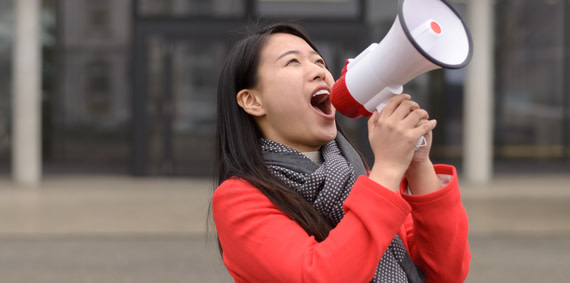 Young person with a megaphone.