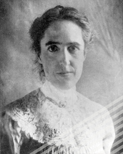 A black-and0white photograph of Henrietta Swan Leavitt, staring directly into the camera with her hair pinned back.