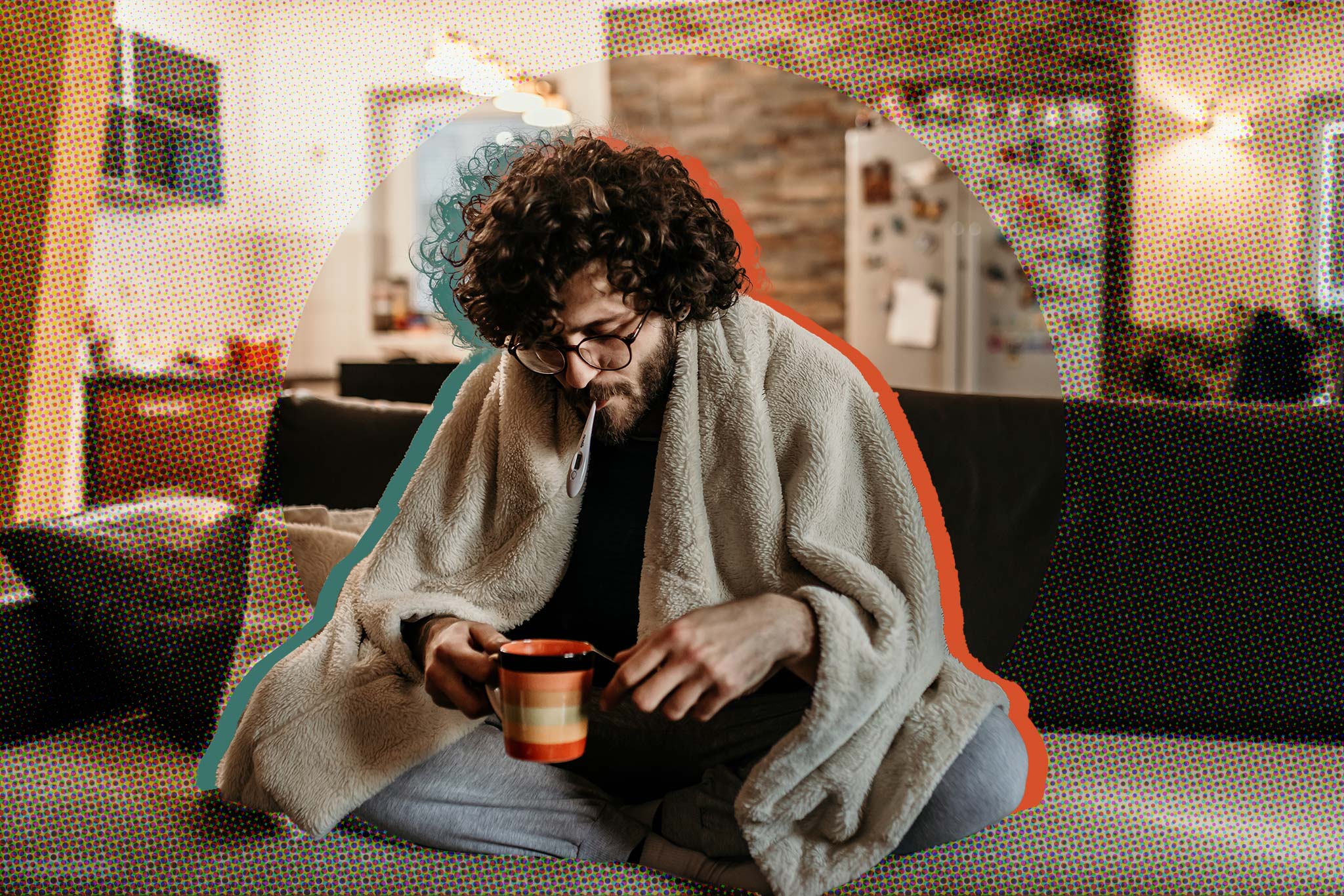 Image of a sick student at home, wearing a blanket and drinking tea
