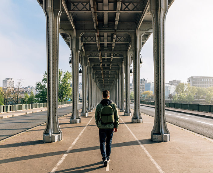 Person under a bridge