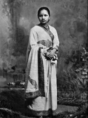 A black and white photo of Anandi Gopal Joshi standing and looking toward the camera