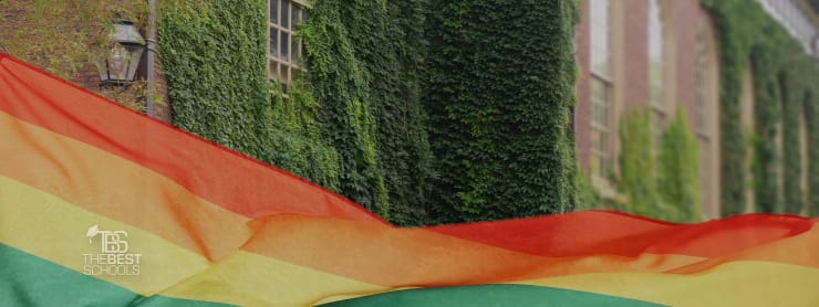 Image of Gay Pride flag with covery college building in background.