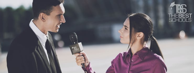 Hero Image for What Can You Do With a Communications Degree?: Female TV reporter interviewing a well–dressed man outside