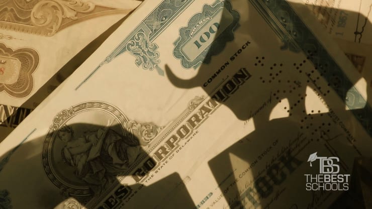 The Best Online Master’s in Economics Degree Programs: Close up shot of one hundred dollar bills