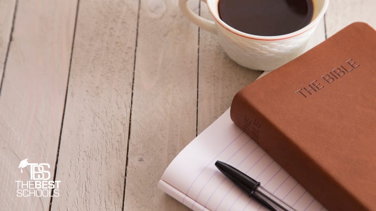 Best Online Doctorate in Ministry Programs (image of Bible with leather cover on a wooden table)