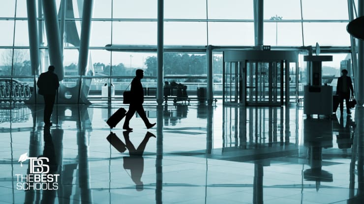 Best Online Master’s in Homeland Security Degree Programs Hero Image: People walking in an airport terminal