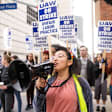 Gloria Bartolo, a 2nd year molecular biology PhD student, leads UCLA postdoctoral scholars and academic researchers on a strike through Westwood, Los Angeles, as they demand better wages, student housing, and child care from the University of California on December 1, 2022.