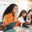 College students working on laptops