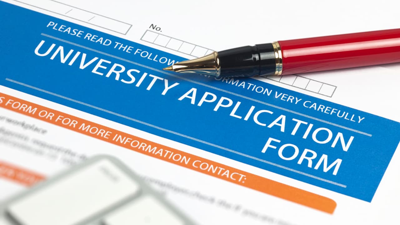 Filling out a college application form.