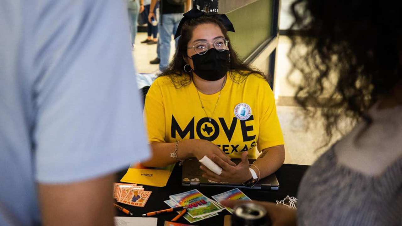 Jazmin Gonzalez, field canvasser with MOVE Texas, chats with students about voter registration during a Spanish Heritage Month event at the TCC South Campus in Fort Worth, Texas. The organization aims to increase participation in elections and voter registration. (Yffy Yossifor/Fort Worth Star-Telegram/Tribune News Service via Getty Images)