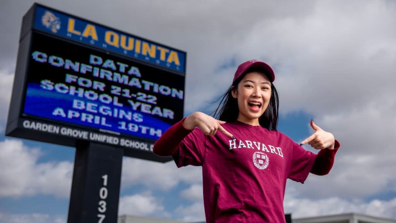 WESTMINSTER, CA - APRIL 21: La Quinta High School senior Julia Do shows her Harvard T-shirt outside the high school in Westminster on Wednesday, April 21, 2021. Harvard was one of 15 prestigious colleges she received an acceptance letter from. "u201cI"u2019m 90% sure i"u2019m going to Harvard, but I won"u2019t be deciding until after April,"u201d Do said. (Photo by Leonard Ortiz/MediaNews Group/Orange County Register via Getty Images)