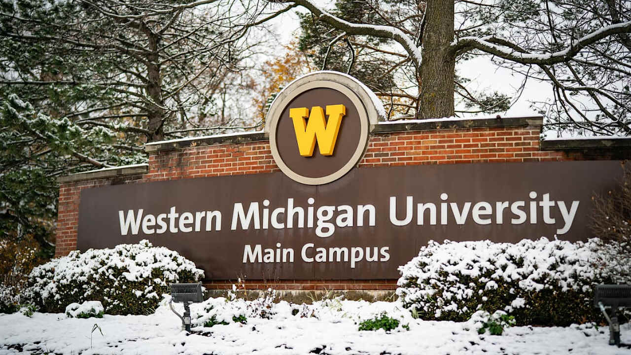 A picture of the front sign at Western Michigan University outside in the snow. The sign reads: Western Michigan University Main Campus.