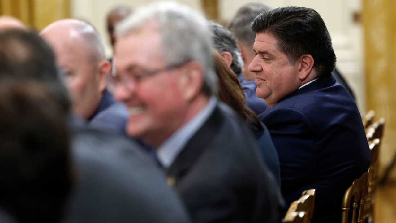 Illinois Governor J.B. Pritzker (R) speaks with other governors before the start of a meeting between U.S. President Joe Biden and governors visiting from states around the country in the East Room of the White House.
