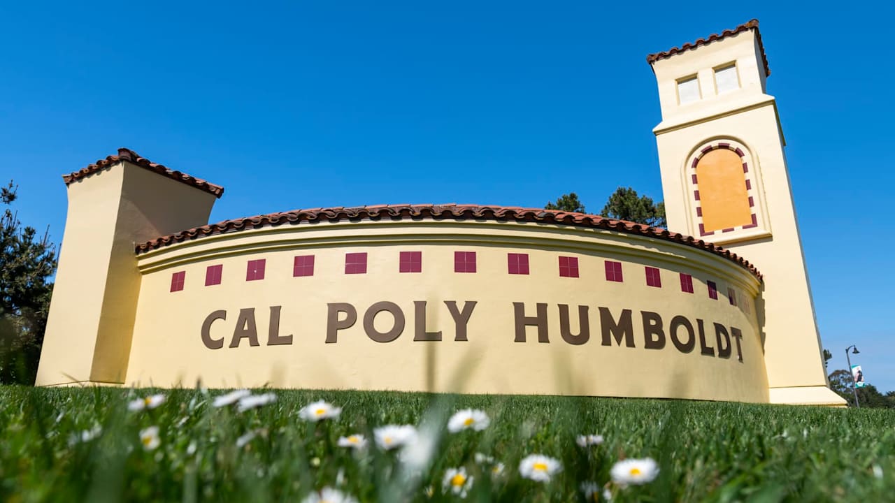 Photo of a sign on Cal Poly Humboldt campus that ssays "Cal Poly Humboldt".