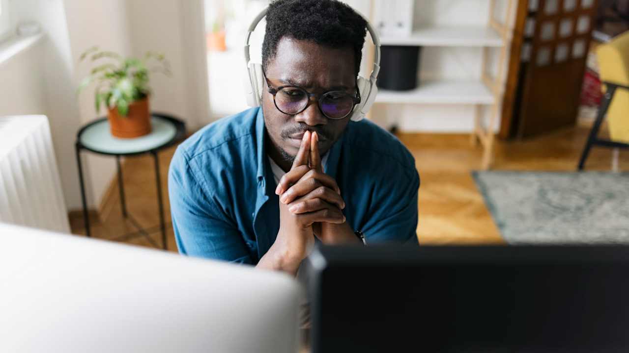 Male college student working from the comfort of his home