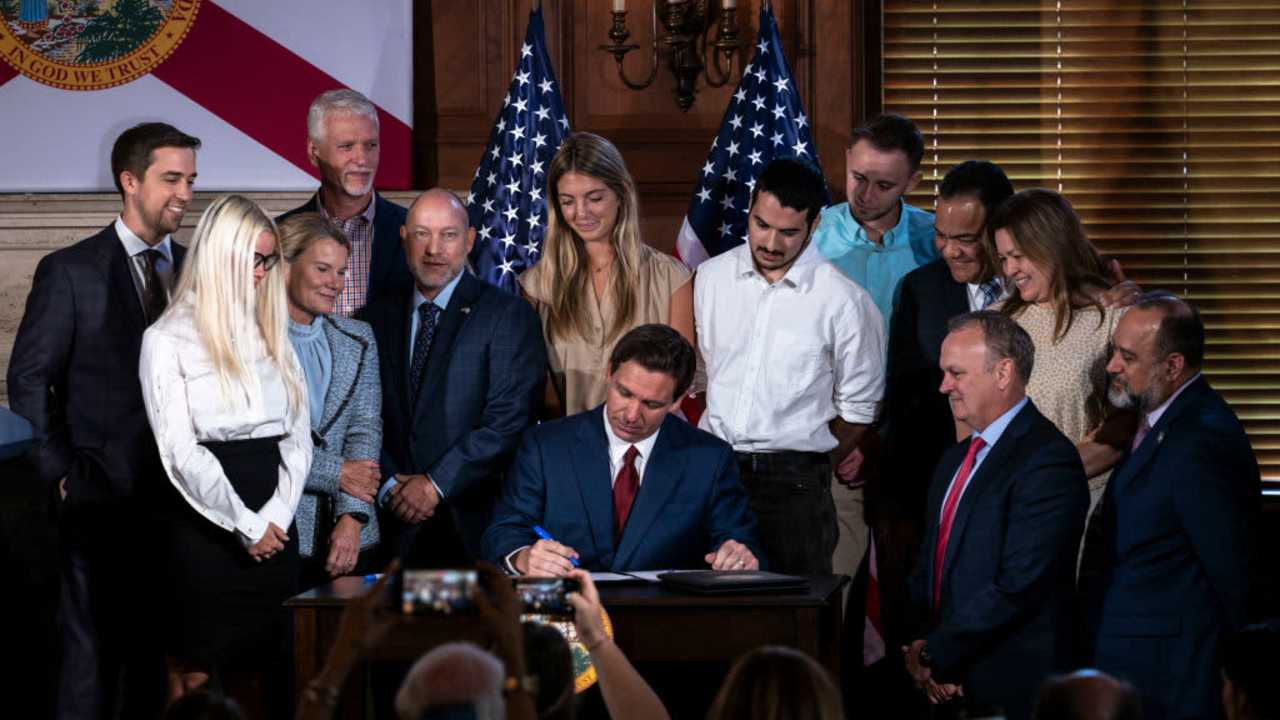 Florida Governor Ron DeSantis signs three education bills on the campus of New College of Florida in Sarasota, Fla.