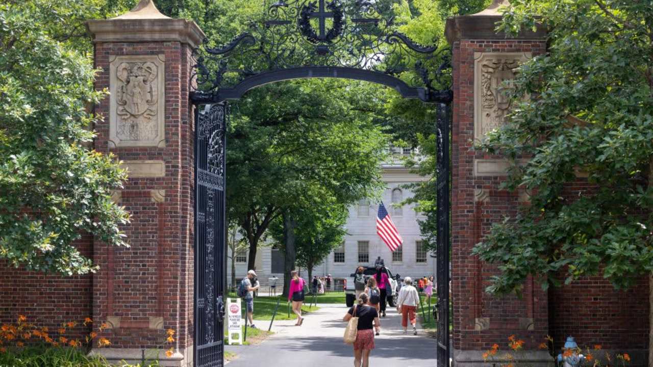 Students walking through the gate in Harvard Yard