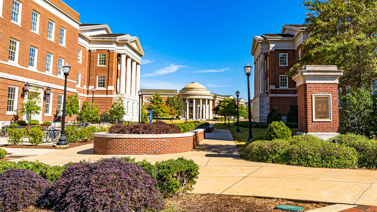 Buildings surrounding the Shelby Quadrangle at the University of Alabama in Tuscaloosa, on a sunny spring day.