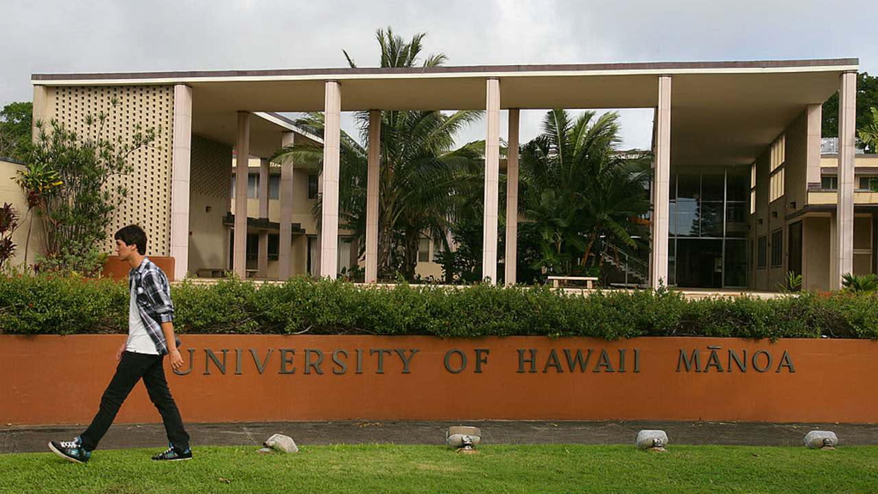 A student walks on campus at the University of Hawaii Manoa in Honolulu.