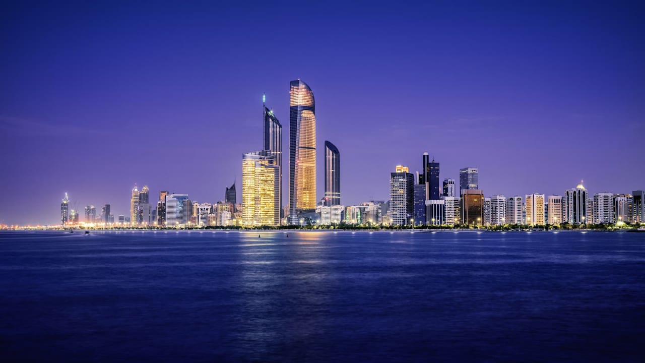 Illuminated nighttime skyline of Abu Dhabi