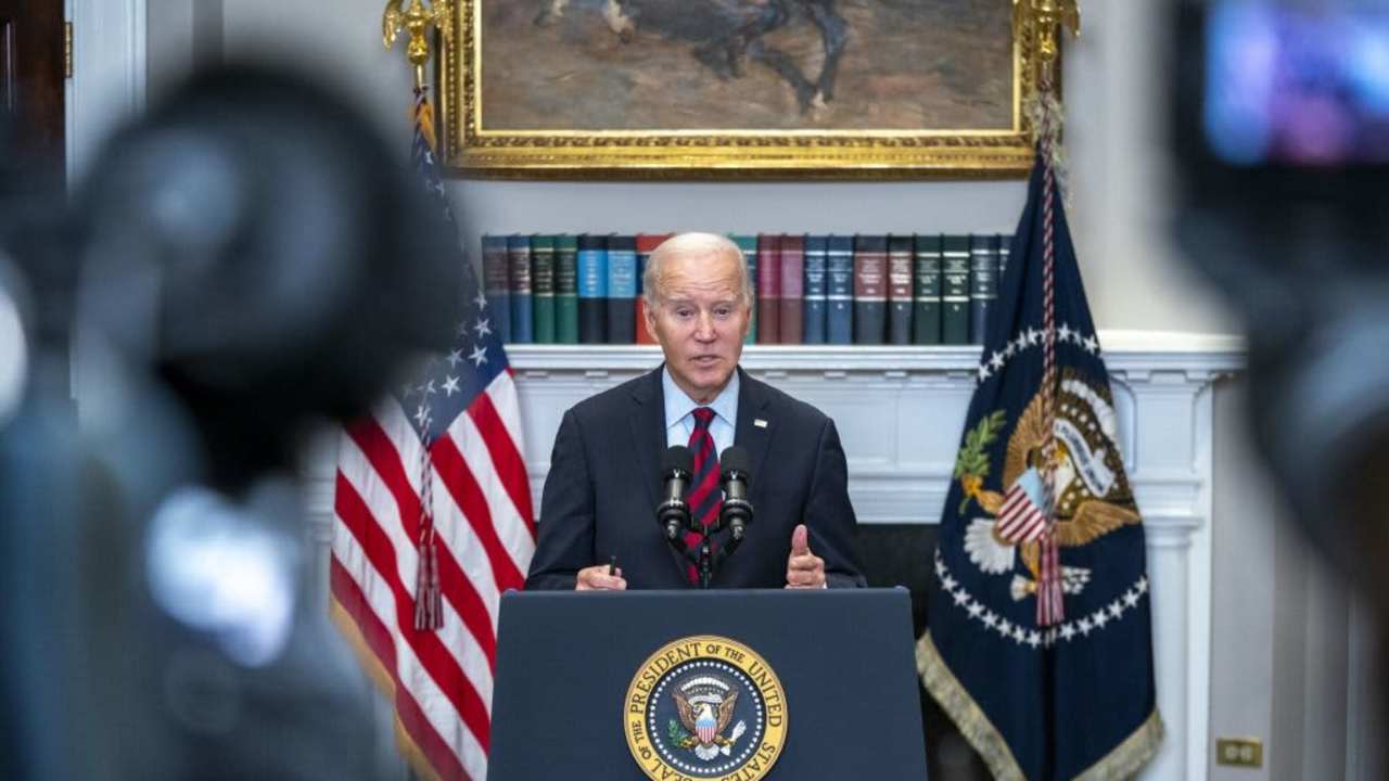 President Biden speaking at podium in White House