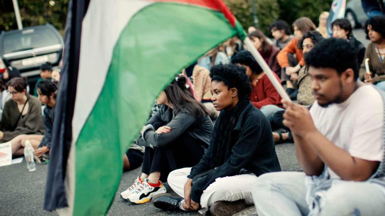 Activists and pro-Palestinian participants attend a vigil organized by a group of Jewish, Muslim, and Christian students to protest the Israel-Hamas conflict.