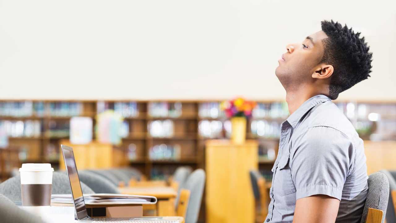 College student frustrated in library
