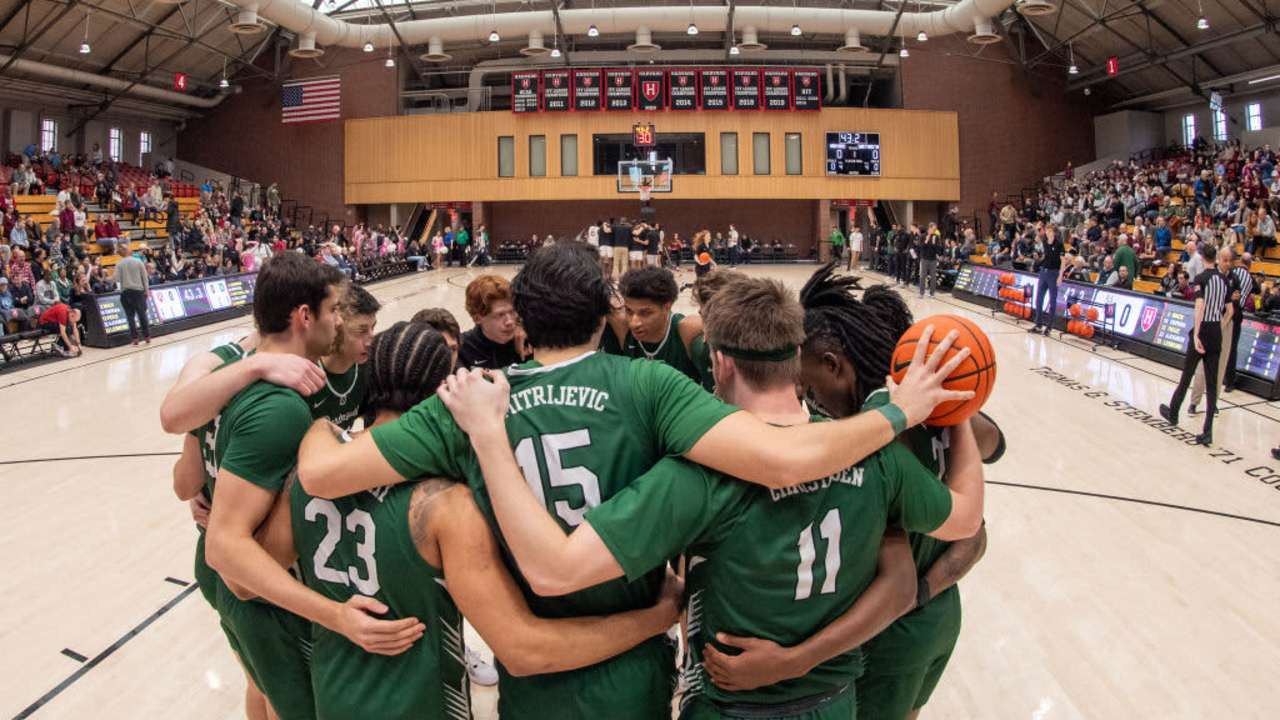 Dartmouth Big Green players huddle as a team before the college basketball game between the Dartmouth Big Green and the Harvard Crimson