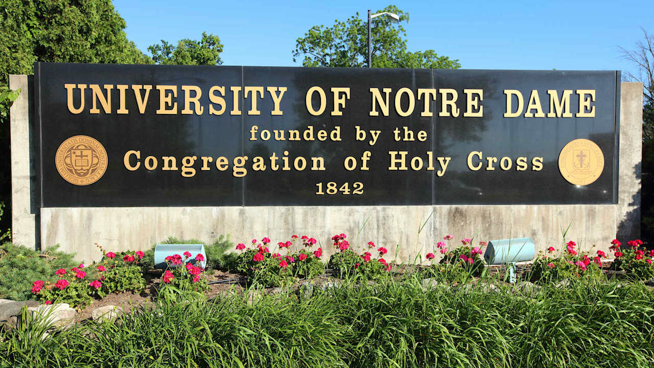 Daytime view of the University of Notre Dame campus entrance sign.