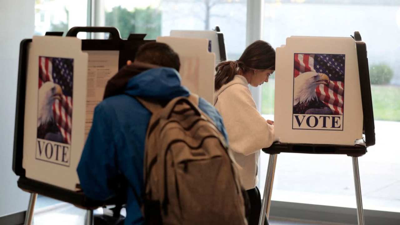 Students cast their ballots for the 2022 US general election at the city clerk's satellite office on the University of Michigan campus in Ann Arbor.