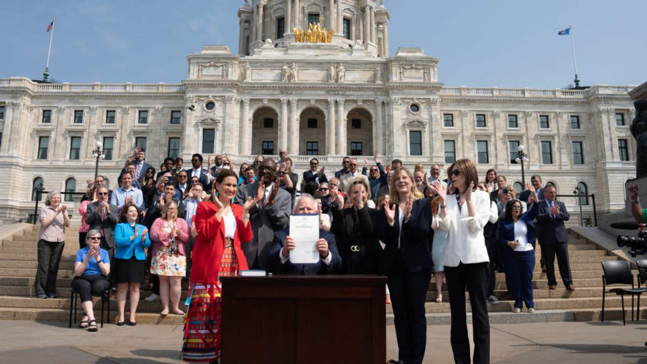 ST. PAUL, MN. - MAY 2023: Along with DFL legislative leaders and his commissioners, Minnesota Gov. Tim Walz threw a ceremonial budget bill-signing party Wednesday morning on the State Capitol steps.