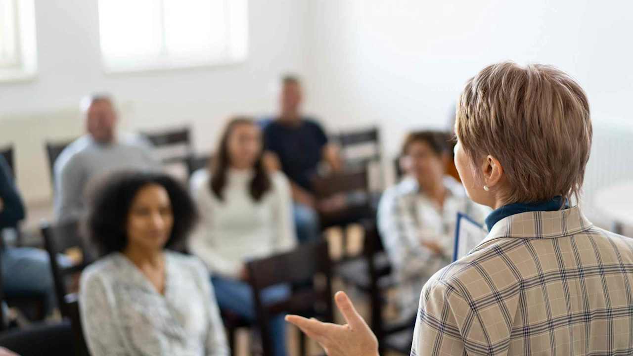 Therapist leading support group