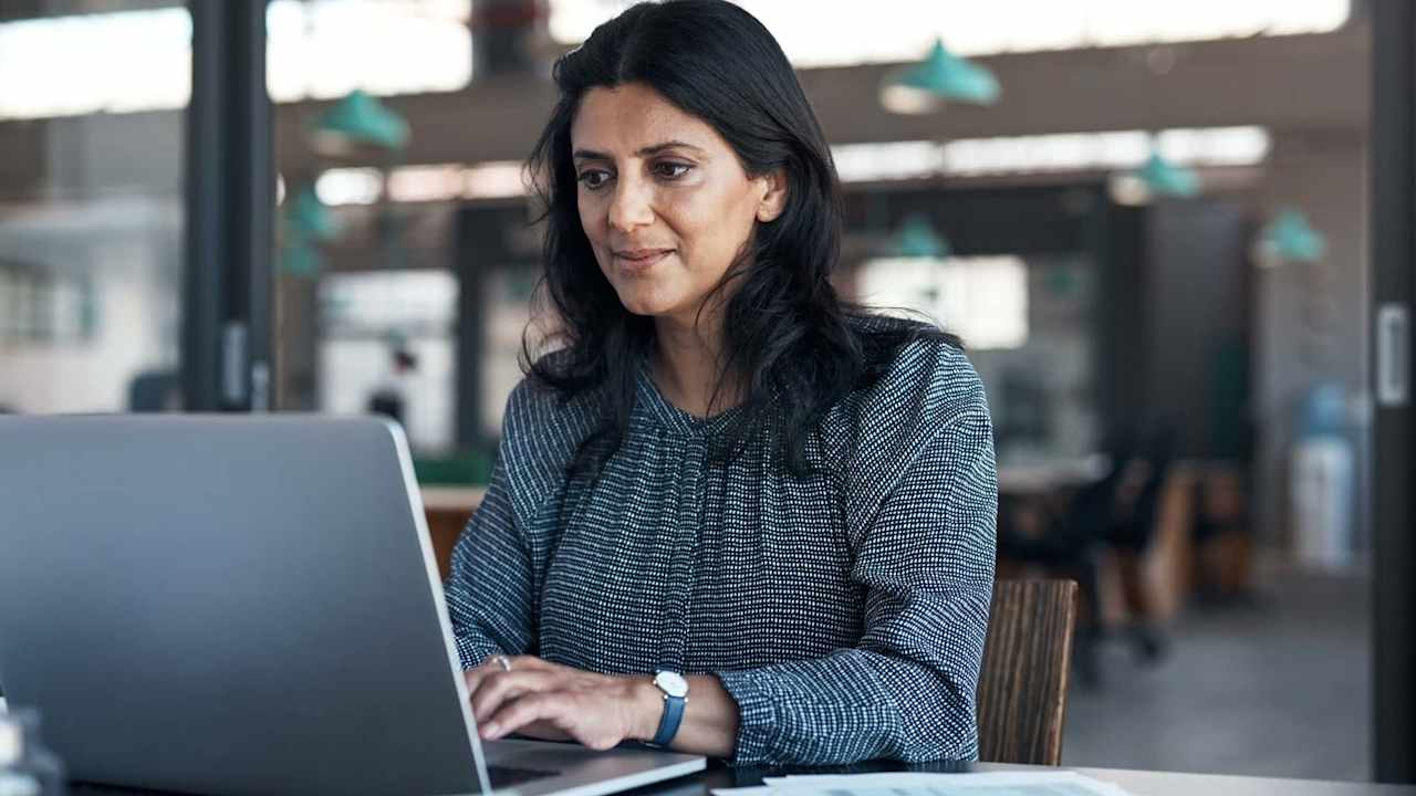 Business person using laptop