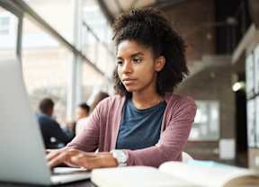 Woman typing on laptop